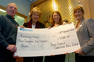 Councillor Jimmy Eaton and MP Janet Anderson present a cheque to Rossendale Hospice